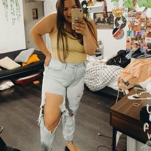 heavily distressed denim jeans